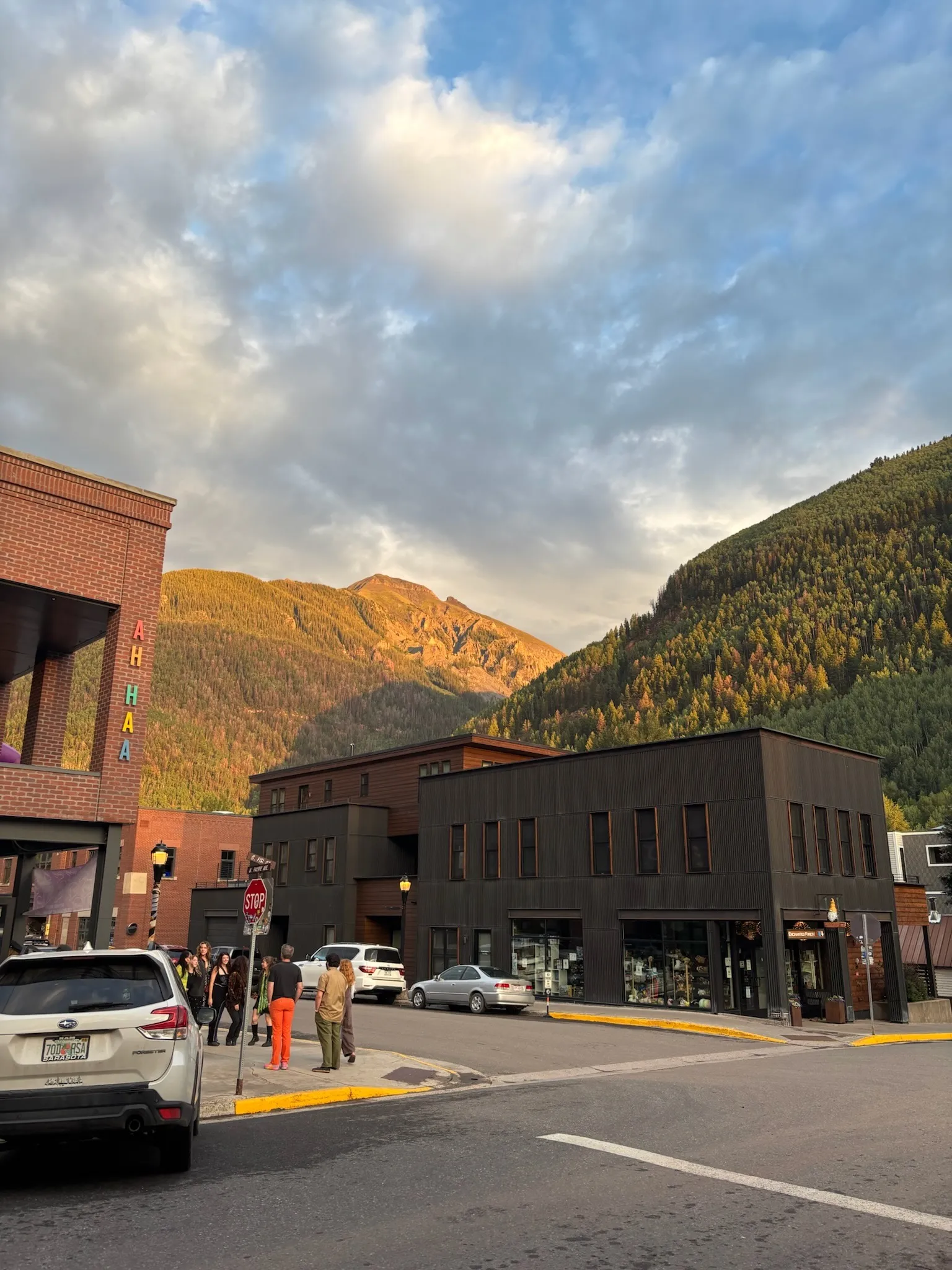 Alpenglow on the peaks above the brick storefronts